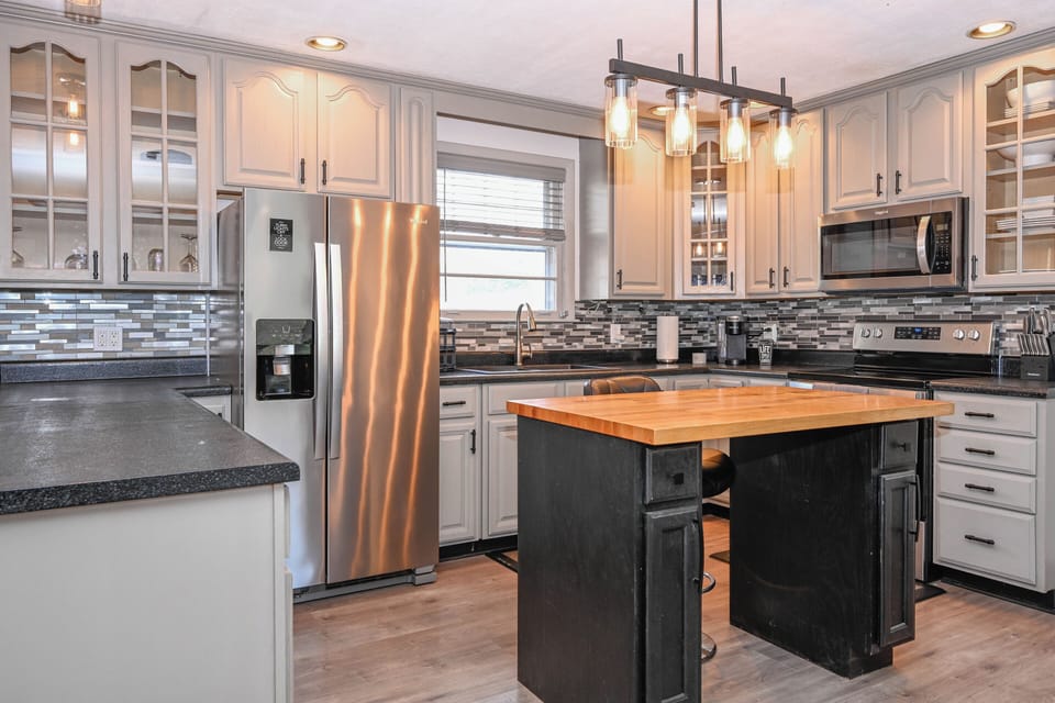 This well-equipped kitchen is not just a culinary workspace; it's a symphony of form and function, offering the tools and ambiance to inspire culinary creativity and ease in meal preparation for both casual dining and sophisticated entertaining.






