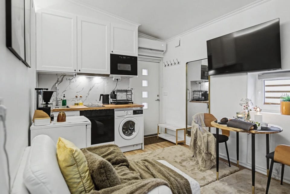 Fully equipped kitchenette with washing machine, coffee setup and dining table