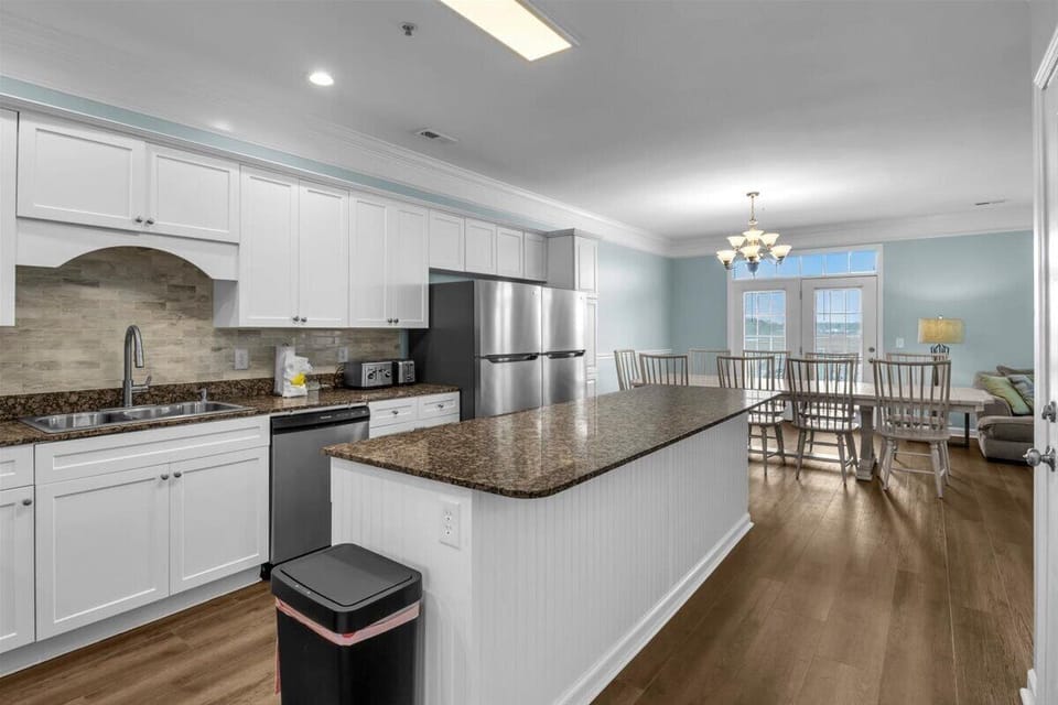 Kitchen View Into Dining Area with Balcony View