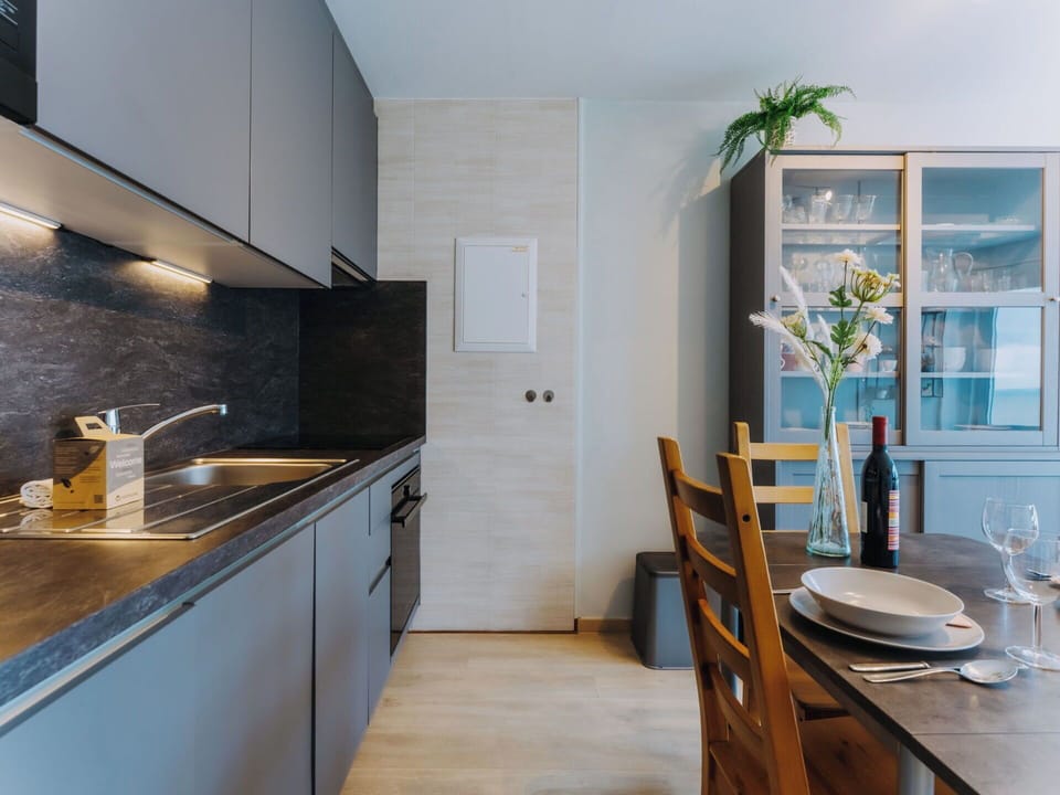 Kitchen, Countertop, Furniture, Interior Design, Kitchen Appliance, Flooring, Cabinetry, Wood, Floor, Ceiling