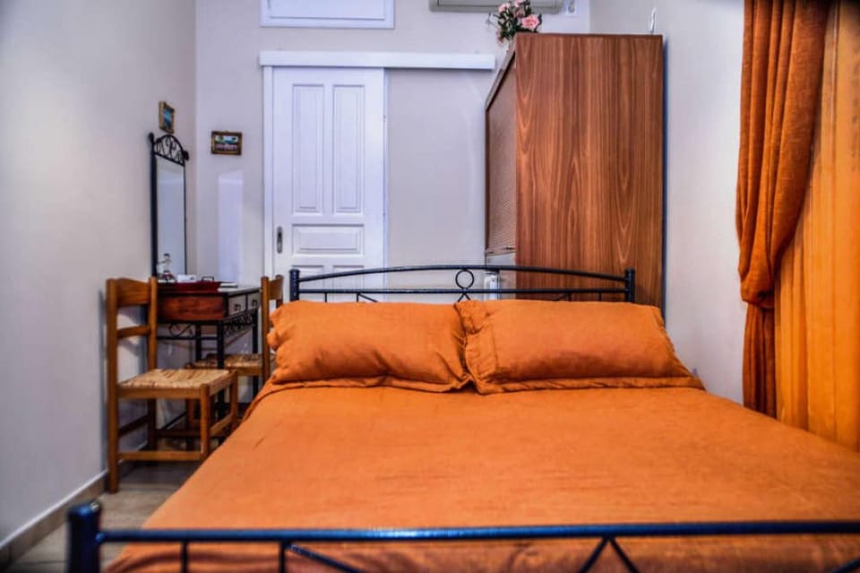 
Studio interior with comfortable bed and classic décor.