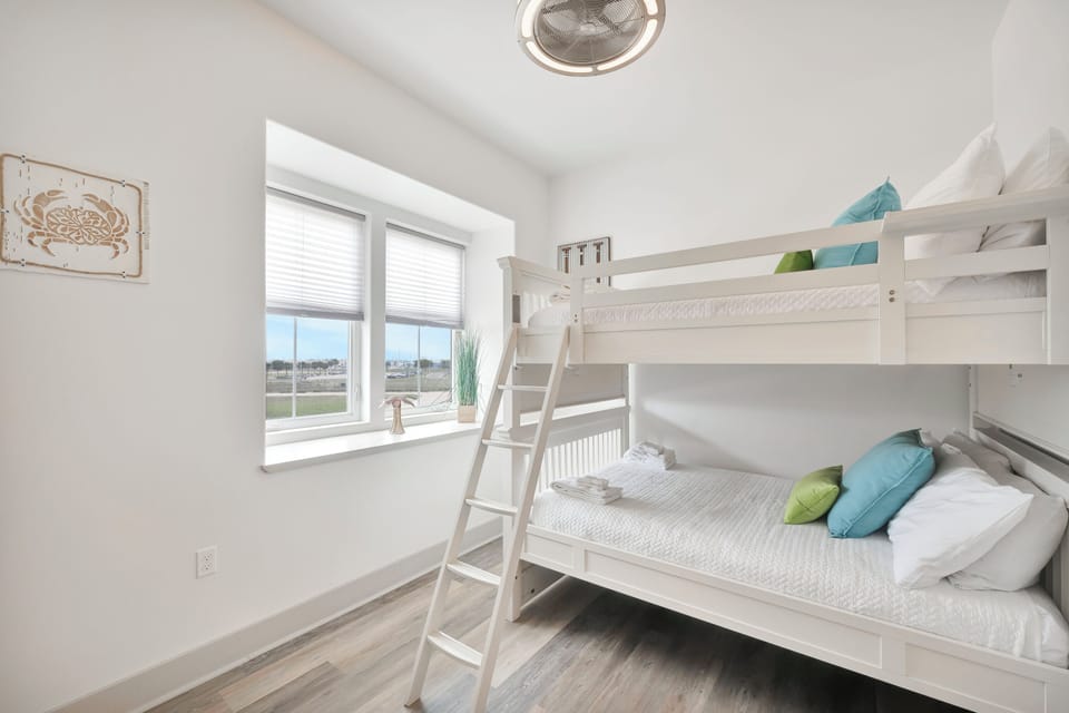 Your kids will love this bright bunk bed room with scenic views, perfect for creating vacation memories together.