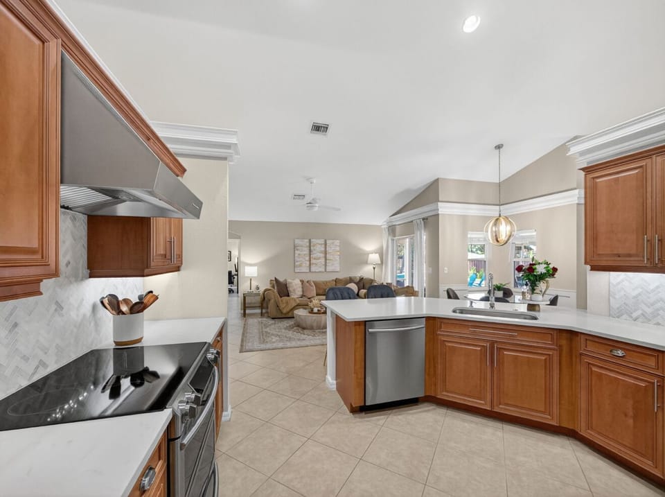 The kitchen is fully equipped with modern appliances 