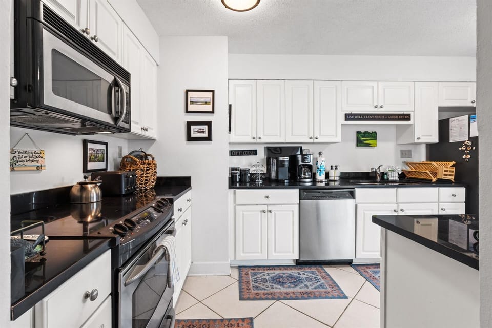 Your fully-equipped kitchen invites culinary adventures with stainless steel appliances, granite countertops, and everything needed for memorable meal preparation.