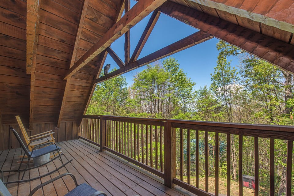 Unwind on your private covered deck with peaceful forest views and comfortable seating for morning coffee or evening relaxation.