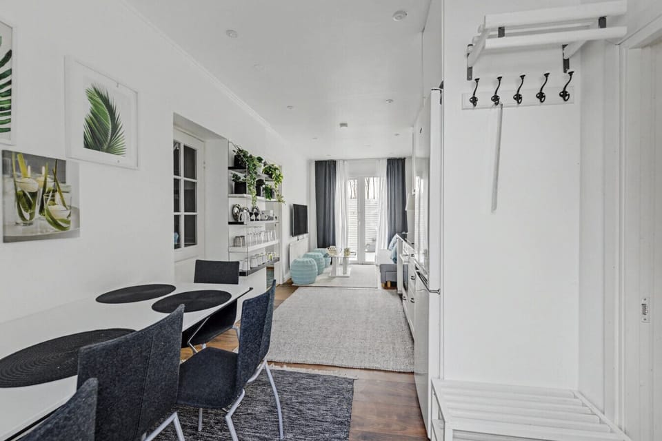 Entrance area with practical coat hooks and immediate access to the open-plan kitchen and lounge. Designed for easy arrivals for families and groups.