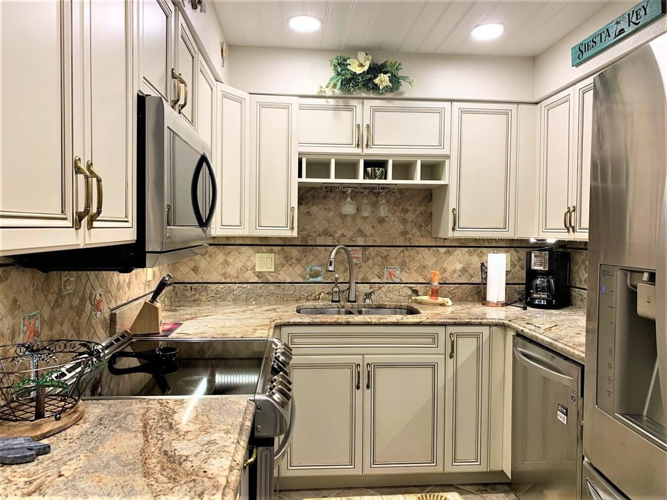 Your fully equipped kitchen features granite counters, stainless appliances, and everything you need to prepare memorable meals during your stay.