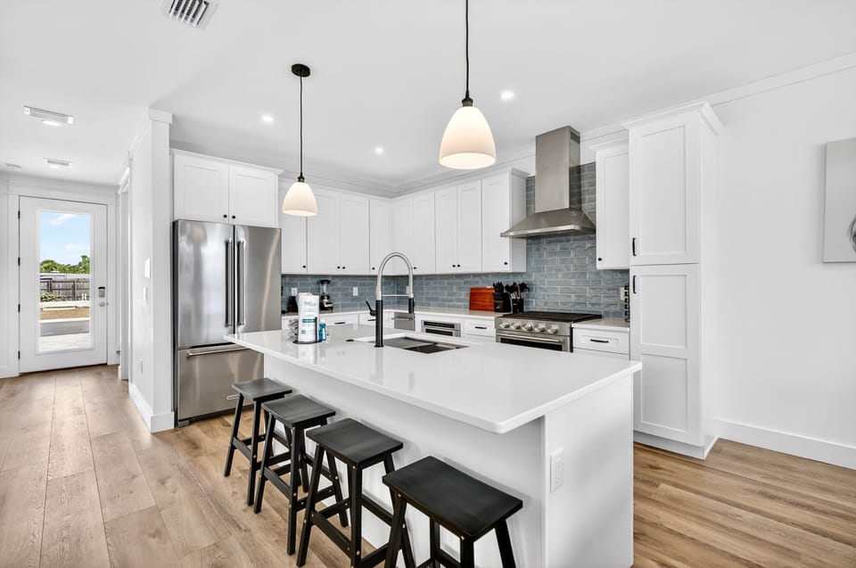 1st Floor - Gourmet chef’s kitchen featuring premium GE Monogram appliances and a 6-burner gas stove—perfect for cooking for a crowd