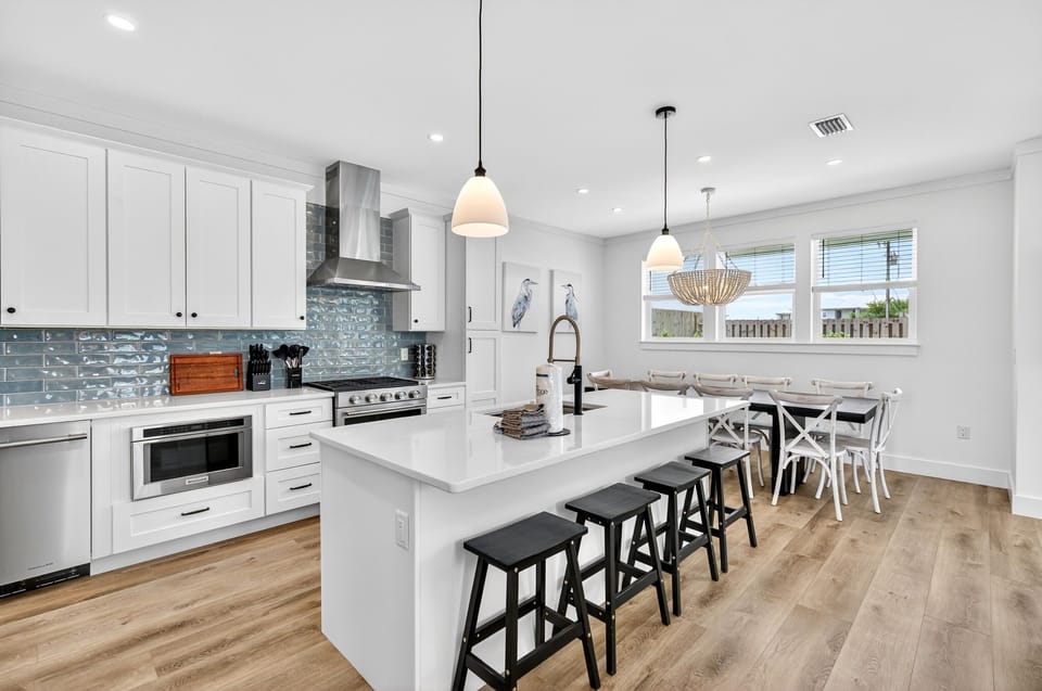1st Floor - Gourmet chef’s kitchen featuring premium GE Monogram appliances and a 6-burner gas stove—perfect for cooking for a crowd