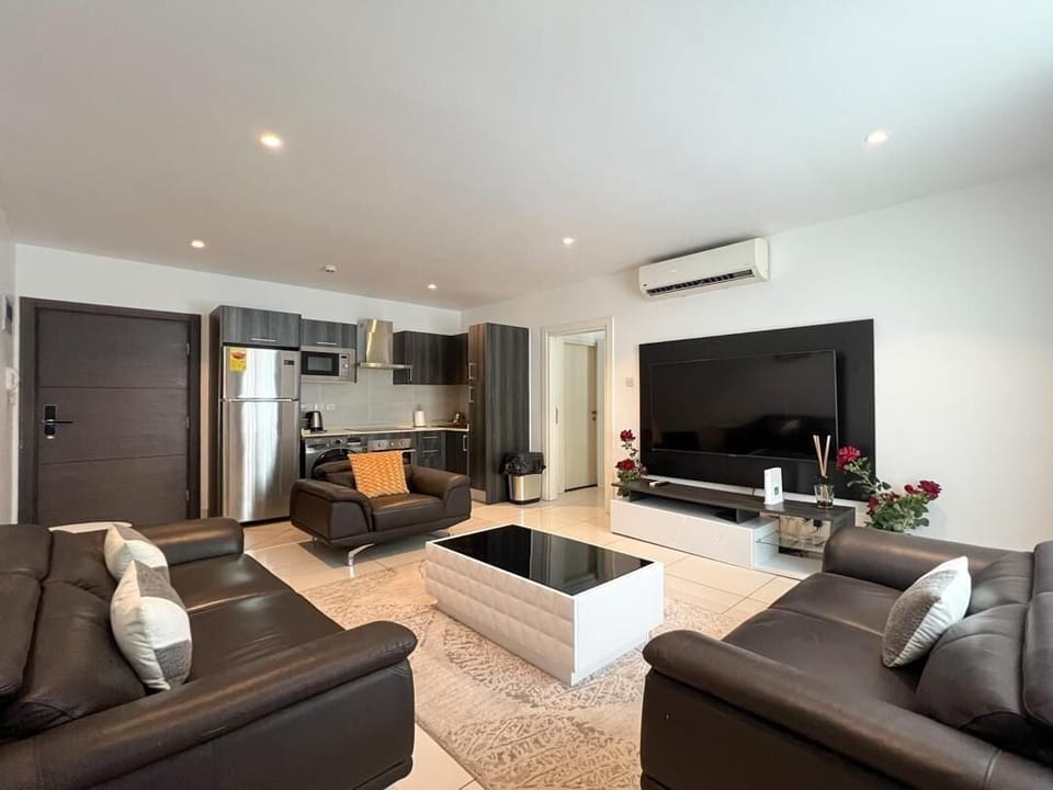 Deluxe Apartment, Ensuite, Pool View | Living area | 52-inch Smart TV with satellite channels