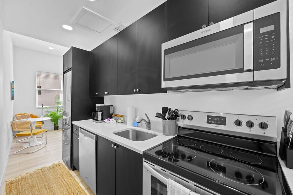 Whip up your culinary masterpieces (or just some popcorn!) in our sleek and fully equipped kitchen. Whether you're a gourmet chef or a microwave maestro, you'll find everything you need right here. Coffee's on us (almost)!