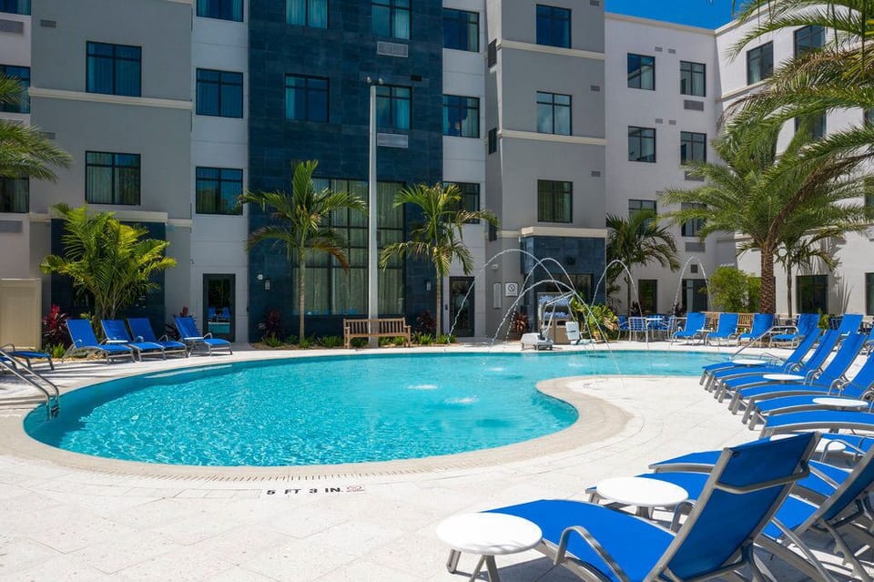 Dive into refreshing waters at the pool, with enticing fountains adding a playful touch to your relaxation.