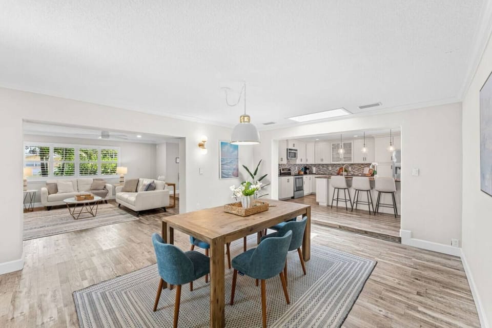 Open dining area with natural light and views into the living room and kitchen.