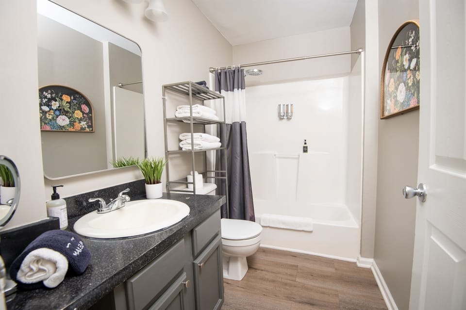 Here is your first full-sized bathroom located in the hallway. Bath and shower mix! Bring your favorite bubble bath! Both bathrooms come complete with shampoo, body wash, conditioner, hand soap, and all the linens you need for a comfy stay.