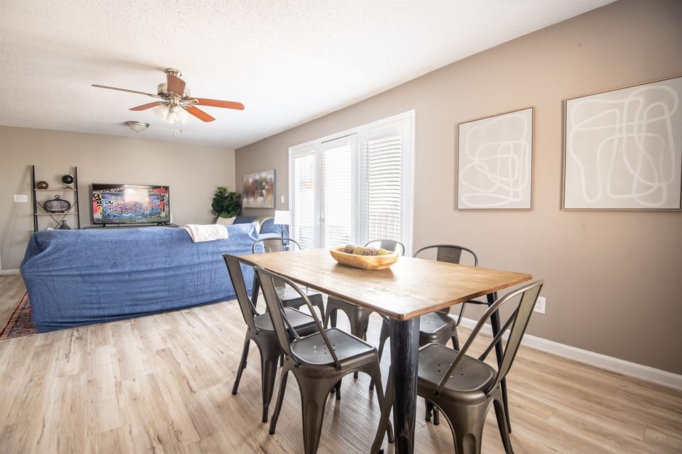 Unit E's dining space has plenty of seating with 6 chairs total and 3 bar seats. Great for a group card game or family meal together!