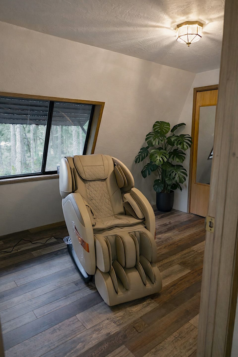 Relaxation corner in the barn loft featuring a full-body massage chair.