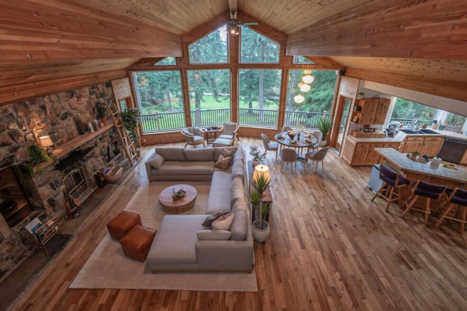 Soaring vaulted ceilings, floor-to-ceiling windows, and warm wood interiors designed for unforgettable gatherings.