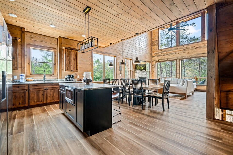 Gather under soaring ceilings where meals, conversations, and family time flow effortlessly from one space to the next.