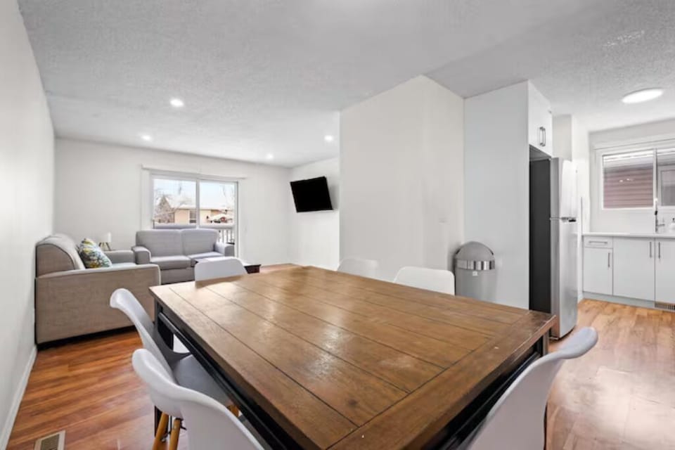 Modern 3BR suite featuring a bright, open living space and full kitchen.