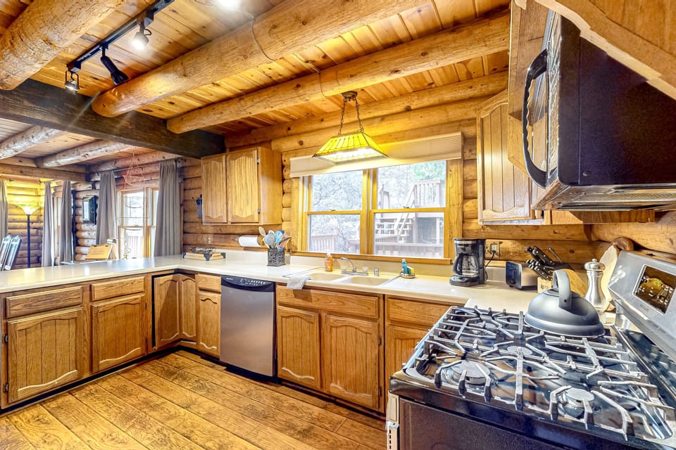Plenty of counter space and a full-size dishwasher make cleanup easy, so you can spend less time on chores and more time enjoying the cabin.