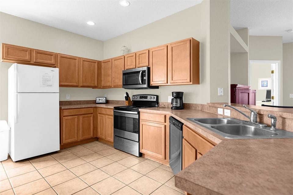 Kitchen View with Full Size Fridge, Stove, Microwave, Dishwasher, Sink, Toaster 