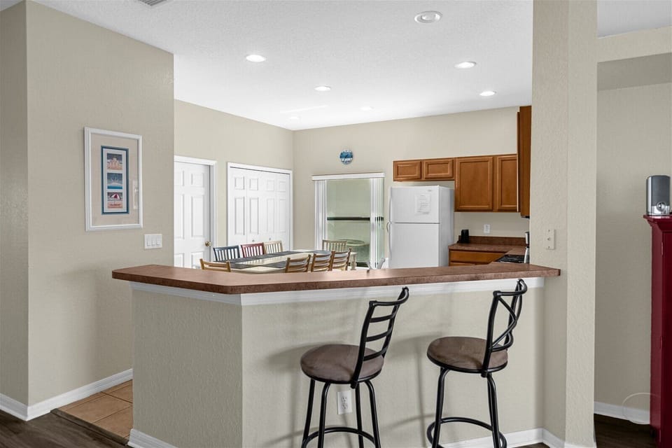 Breakfast Bar Area for 2 People with Kitchen View with Dining Table for 8 People