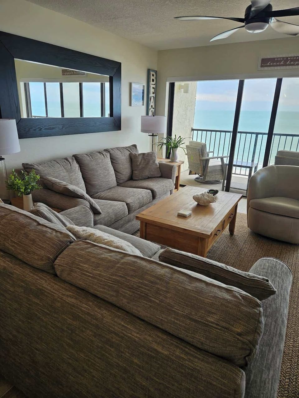 Optimal seating in the living area with a breathtaking view of the Gulf, and includes a 75" smart TV. 