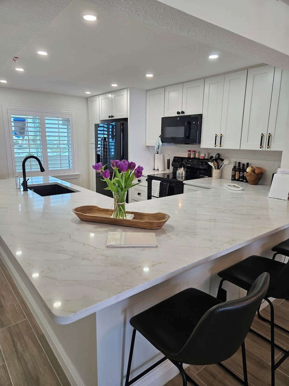 Newly and completely renovated kitchen with all cooking essentials and 3 barstools. 
