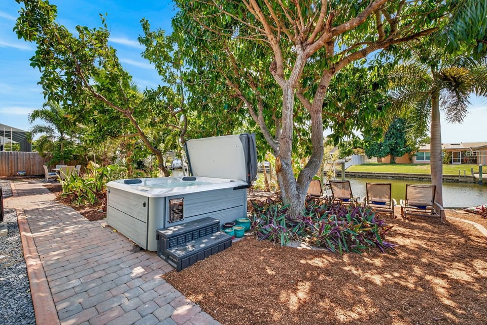 Relax and unwind in the private hot tub at Coral Palm Retreat, the perfect spot to soak under the stars after a day of sunshine and adventure.
