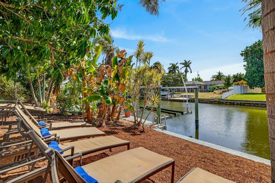 Relax and lay out in the sun while taking in stunning waterfront views of the canal, the perfect spot to unwind and soak up the Florida sunshine.