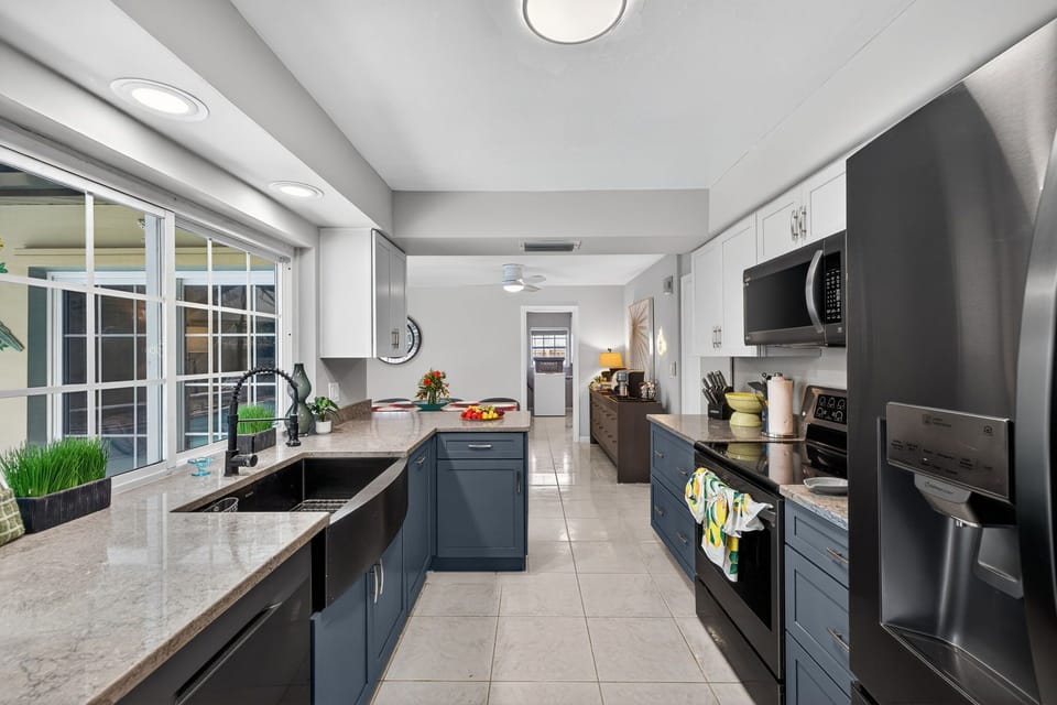 Bright and modern kitchen featuring new appliances, ample counter space, and everything you need to prepare meals with ease during your stay.