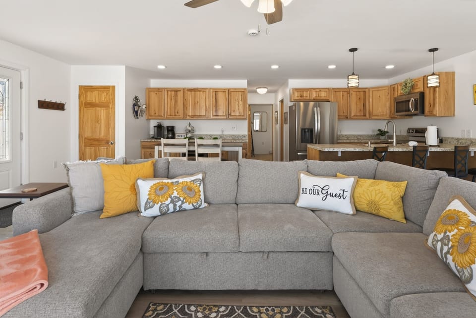 Large sectional beside the open kitchen