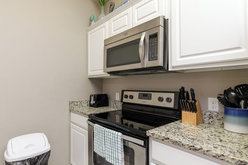 Your fully equipped kitchen awaits with granite counters, stainless appliances, and everything you need to create memorable meals during your stay.