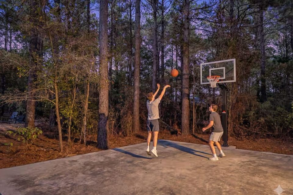 Private woodland basketball court—shoot hoops at sunset.