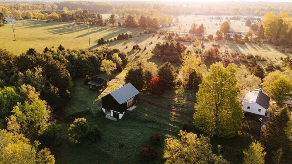 A countryside escape from above 🌅

Wide open fields, rolling green space, and golden-hour light surround the barn and cabin—peaceful, private, and beautifully tucked into nature.