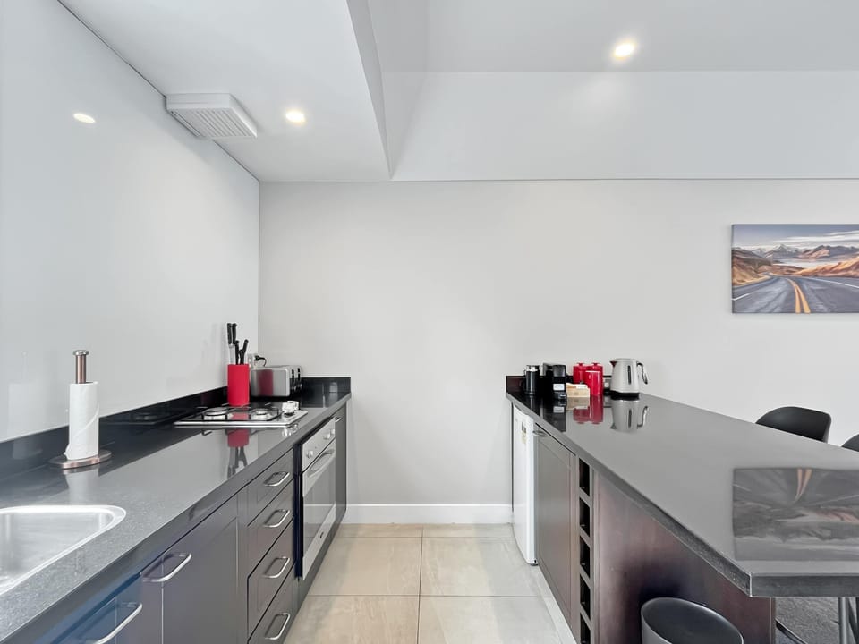 Sleek galley kitchen with modern appliances