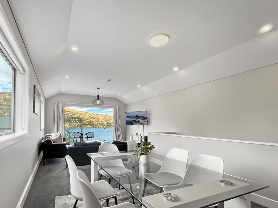Light-filled living and dining area opening to outdoor seating