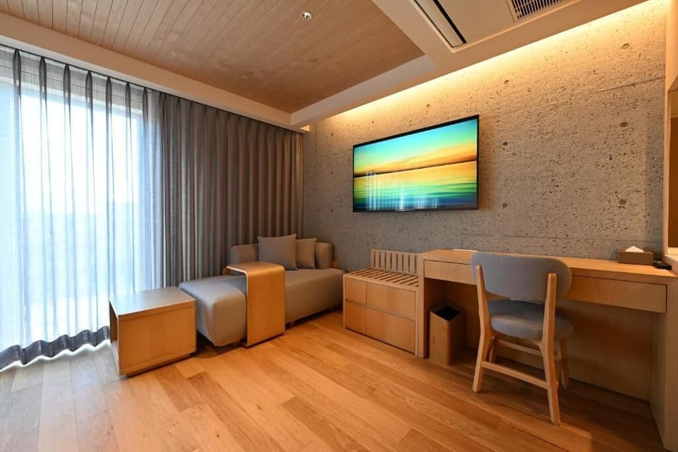 Comfort Triple Room | Living area | 70-cm Smart TV with digital channels, Netflix, streaming services