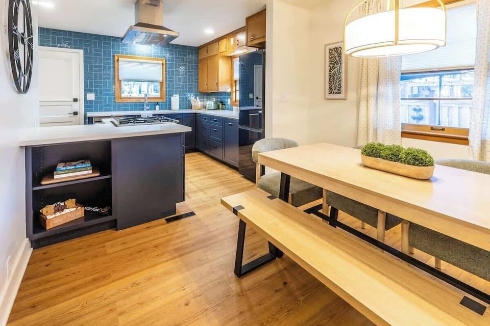 Open kitchen and dining layout keeps cooks connected to the action in the living room.