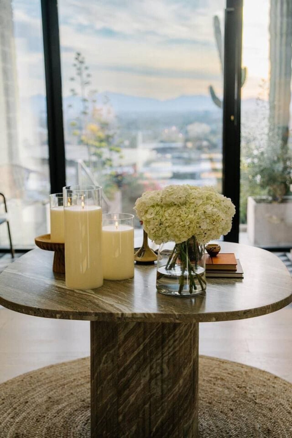 Curated luxury details with candles, florals, and serene indoor outdoor ambiance.