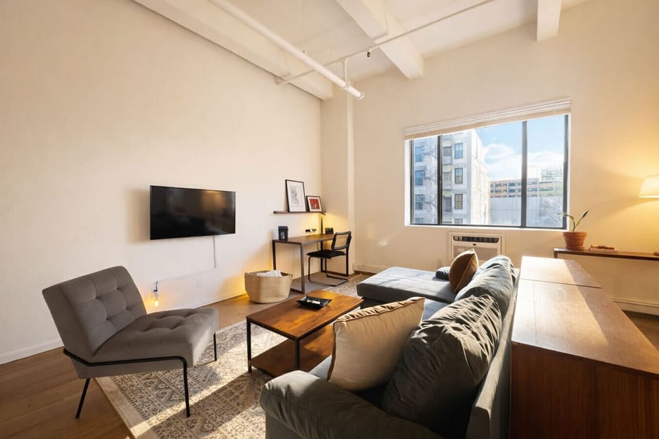 Bright, open-concept living area designed for both relaxation and productivity