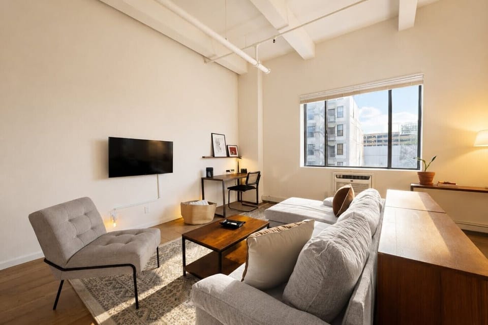 Bright, open-concept living area designed for both relaxation and productivity