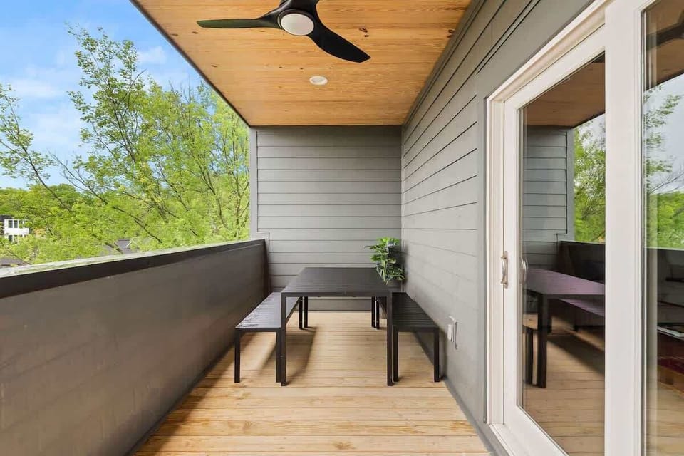 Private balcony with covered seating and a dining area, perfect for morning coffee, evening drinks, or relaxing in the fresh air. (3rd Floor)