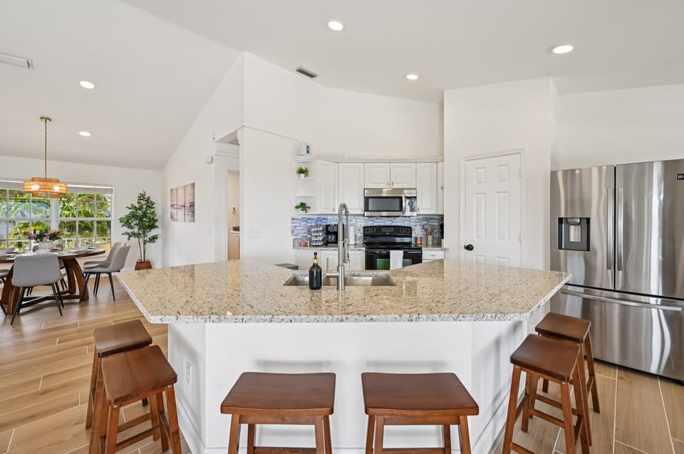 Spacious kitchen with large island and seating for reunion.