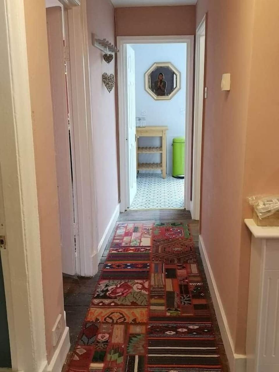 corridor leading to the kitchen. the apartment is much larger than it seems in the photos.
