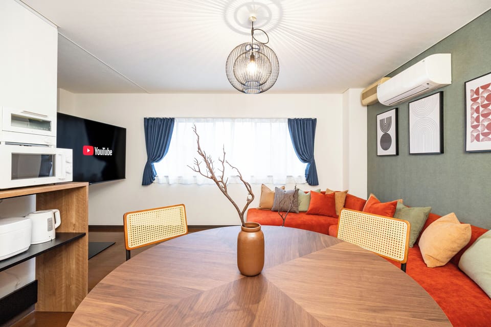 Family Apartment, 3 Bedrooms, Non Smoking, Private Bathroom | Living area | 60-inch Smart TV with cable channels, Netflix, first-run movies