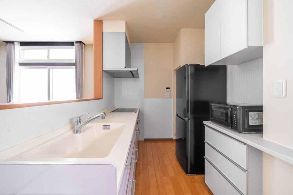 Apartment | Private kitchen | Fridge, microwave, stovetop, rice cooker