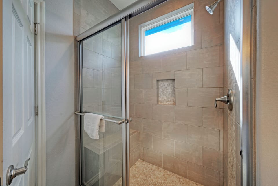 The primary bedroom's ensuite features a shower.