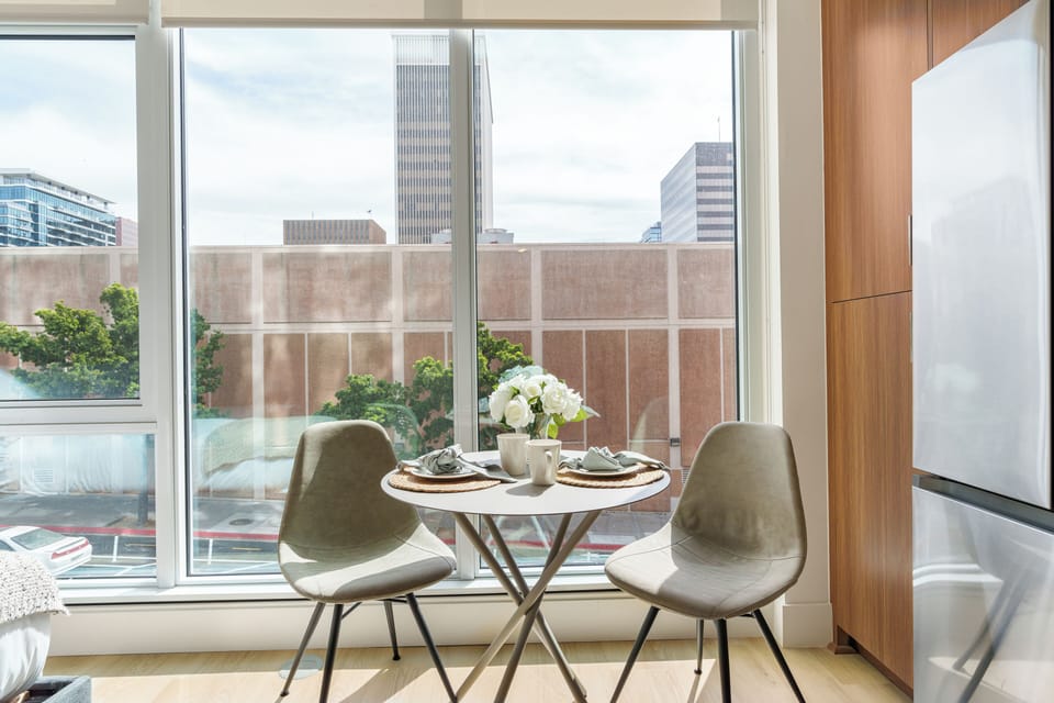Enjoy an intimate meal by floor-to-ceiling windows that bring the neighborhood’s energy inside.