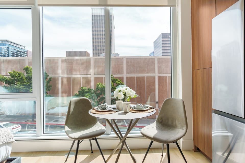 Enjoy an intimate meal by floor-to-ceiling windows that bring the neighborhood’s energy inside.